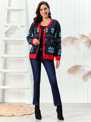 Dark blue acrylic cardigan with snowflake intarsia and red trim, buttoned front.