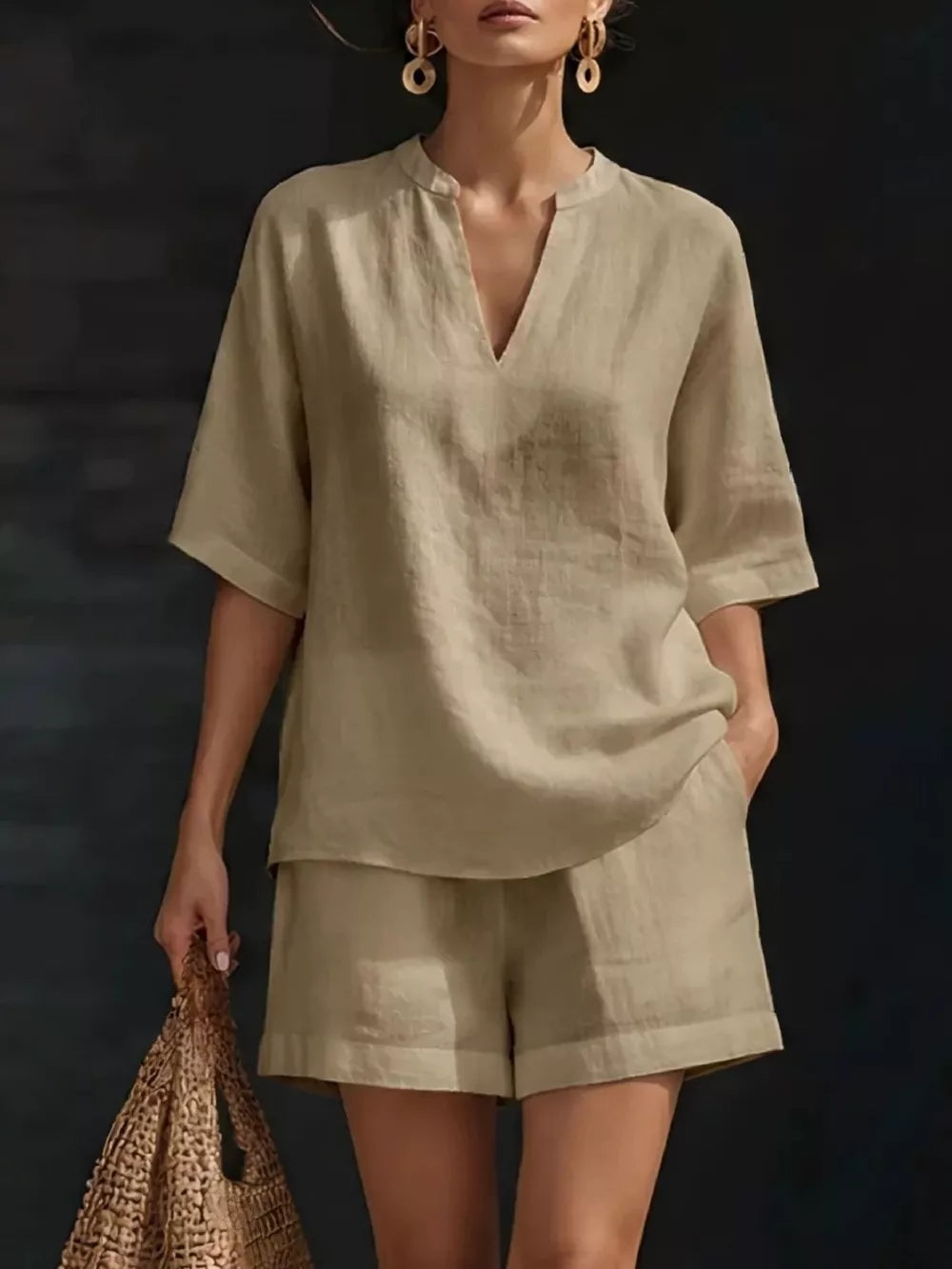 Khaki linen oversized two-piece set with V-neck top and cuffed shorts.