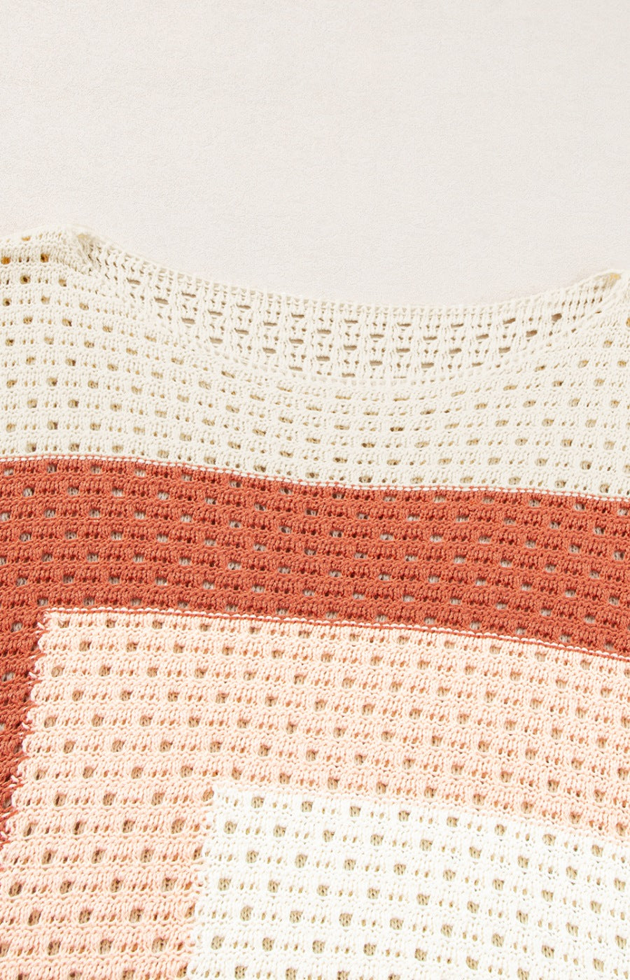Beige crochet knit sweater with ombre stripes and open knit details.