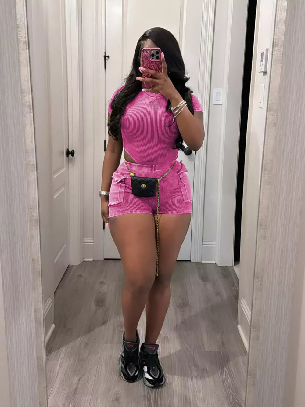 Rose Red ribbed crop top and pocket shorts set with cutouts and chain belt.