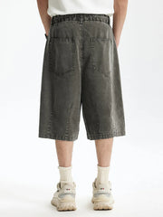 Men's dark gray cotton wide-leg chino shorts with back pockets.