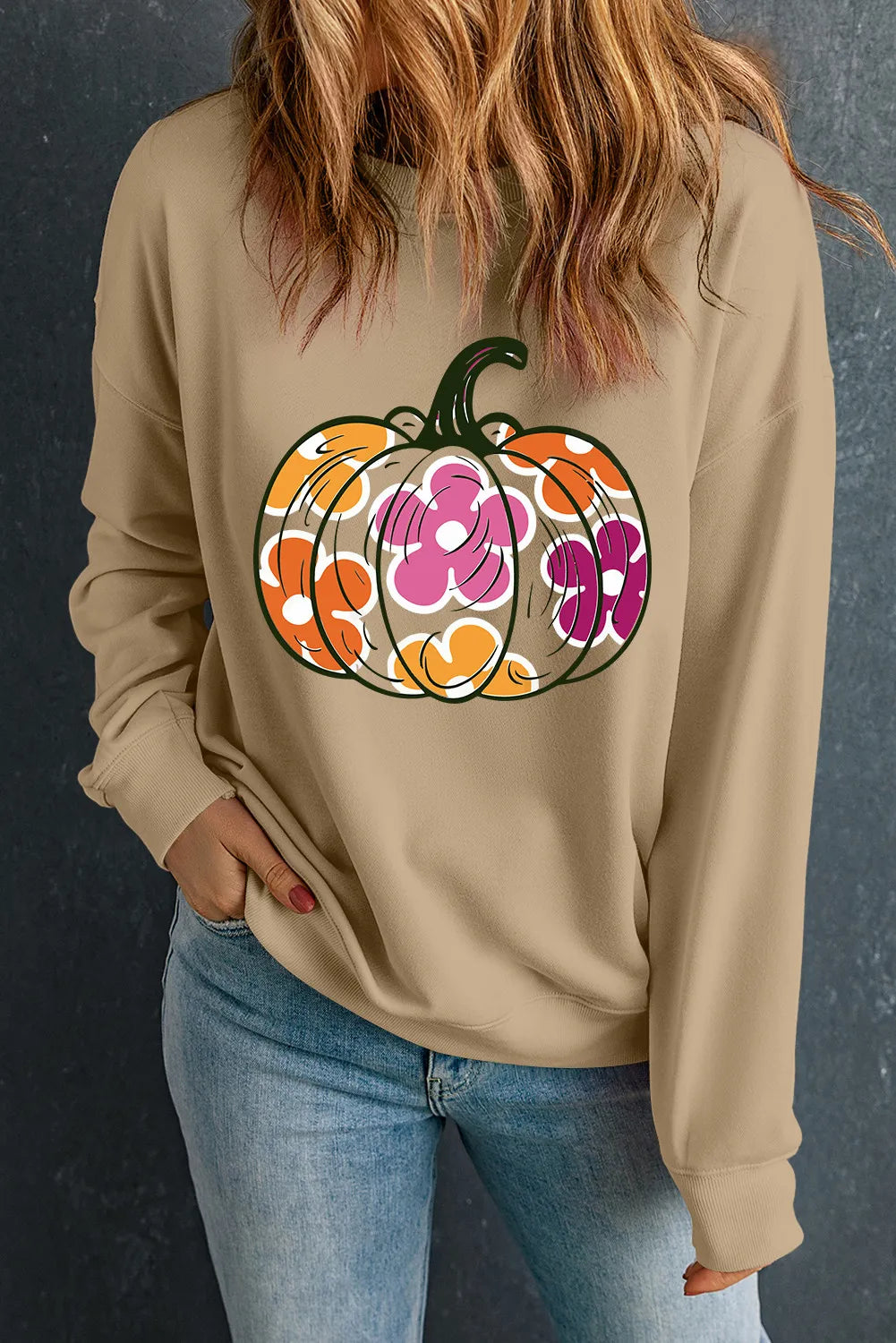 Khaki sweatshirt with a floral pumpkin graphic, long sleeves, and crew neck.