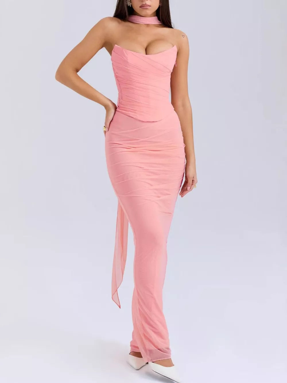Pink sweetheart tube top and flowy maxi skirt set with ruched detailing and a sheer train.