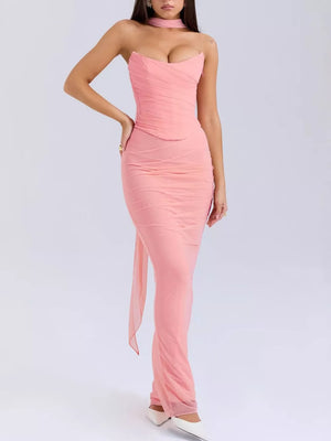 Pink sweetheart tube top and flowy maxi skirt set with ruched detailing and a sheer train.