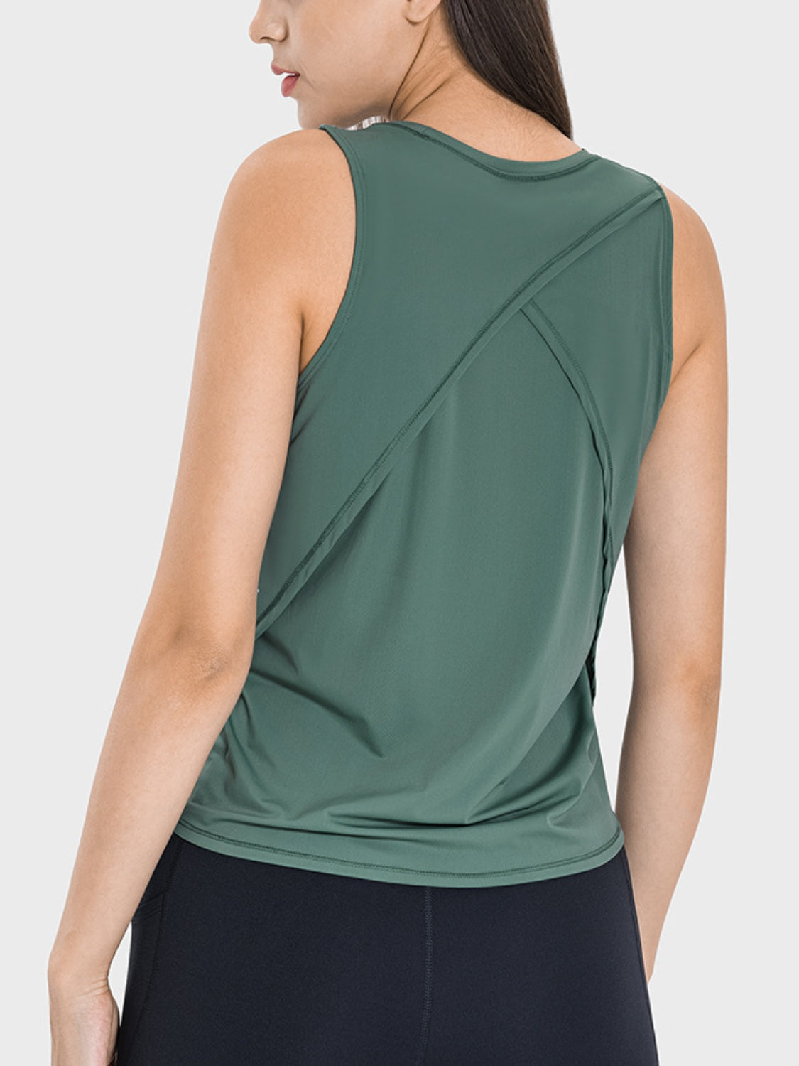 Teal performance tank top with a cross-back detail and crew neck.