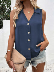 Dusty blue button-down collared sleeveless blouse with v-neck and pearl buttons