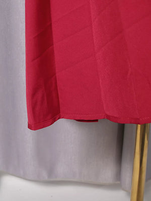 Red midi dress with button placket detail and subtle fabric texture.