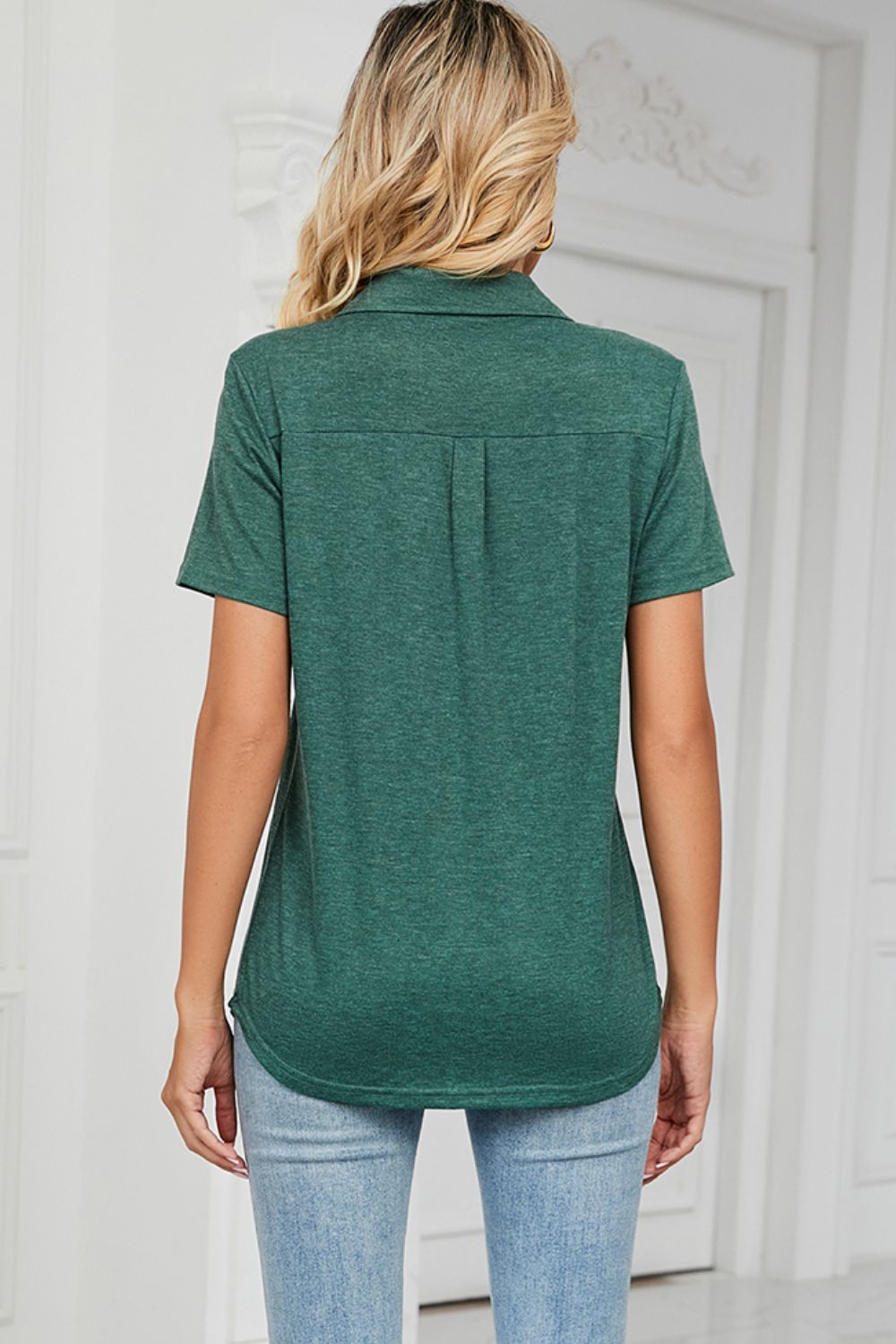 V-neck polo tee in dark green with short sleeves and a pocket detail.