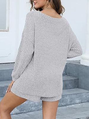 Light gray ribbed knit loungewear set with long sleeves and shorts.