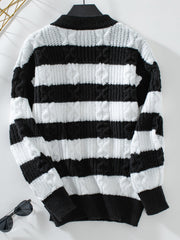 Black and white striped cable knit crewneck sweater with a mock neck.