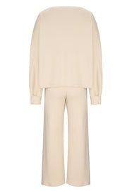 Cream wide-leg lounge set with balloon sleeves and matching pants.