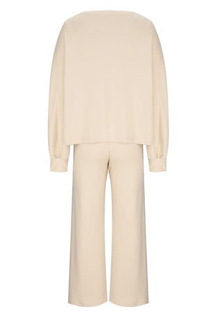 Cream wide-leg lounge set with balloon sleeves and matching pants.