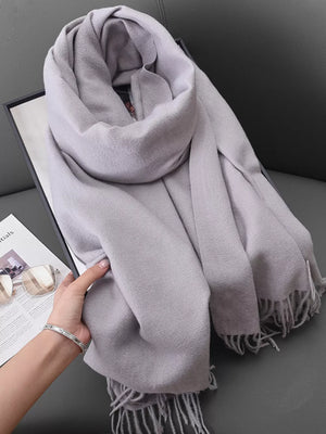 Light Gray scarf with fringe detail and soft texture.