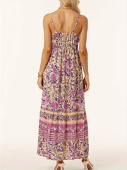 Bohemian floral maxi dress with adjustable waist and cami straps in pink and purple floral print.