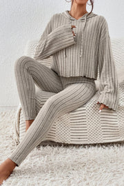 Beige ribbed knit cropped lounge set with hoodie and leggings, featuring lettuce hem details.