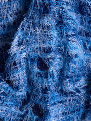 Blue textured knit cardigan with fuzzy yarn and dark buttons