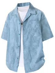 Blue relaxed fit camp collar men's shirt with turquoise buttons and a white undershirt.