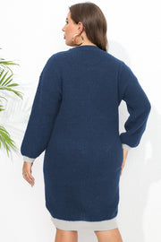 Dark blue ribbed knit dress with contrast trim and long sleeves.