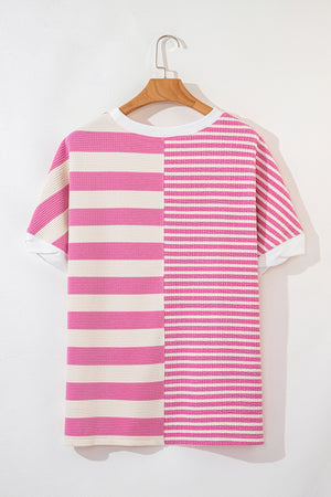 Pink and cream colorblock stripe waffle knit top with crew neck and short sleeves.