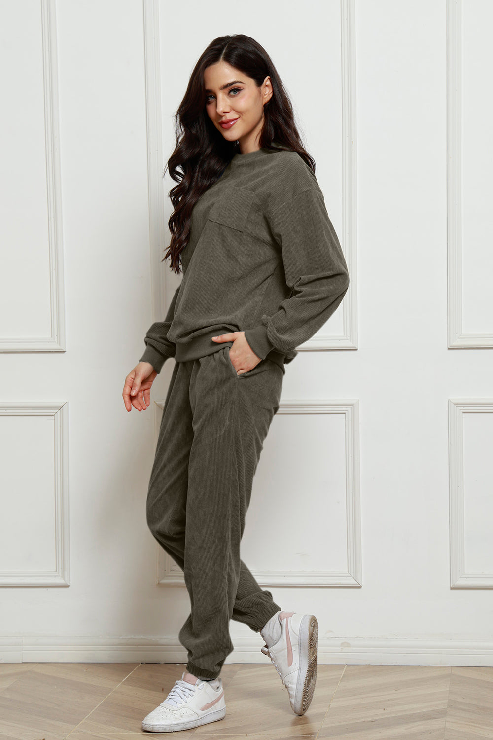 Dark Green corduroy lounge set with crew neck sweatshirt and jogger pants, featuring a chest pocket detail.