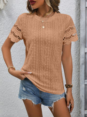 Camel eyelet blouse with scalloped short sleeves and round neckline.