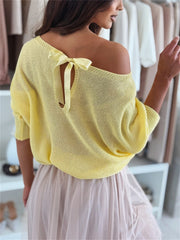 Yellow batwing knit sweater with off-shoulder neckline and back bow detail