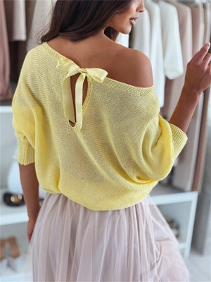 Yellow batwing knit sweater with off-shoulder neckline and back bow detail