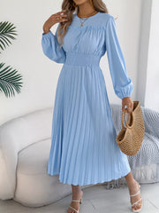 Light blue midi dress with ruffled neckline, smocked waist, and pleated skirt.