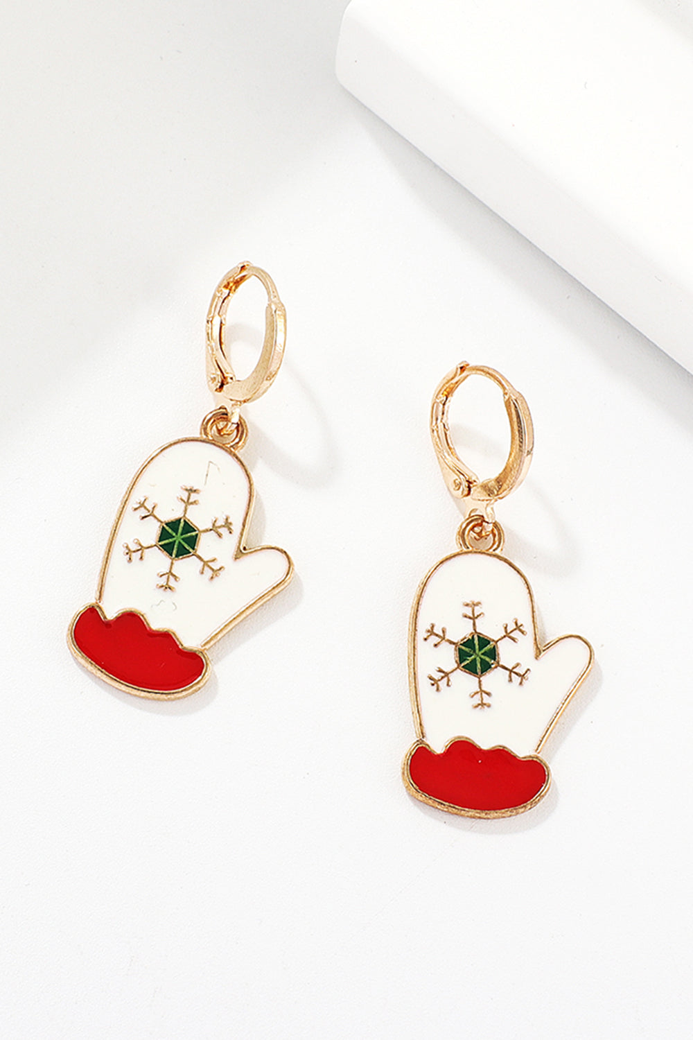 Festive Santa charm hoop earrings with white mitten design, red cuff, and green snowflake detail.
