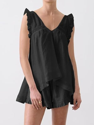 Black ruffled V-neck top and shorts set with lace detail and drawstring waist.