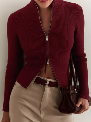 Burgundy ribbed zip-up cardigan with mock neck and silver zipper detail.