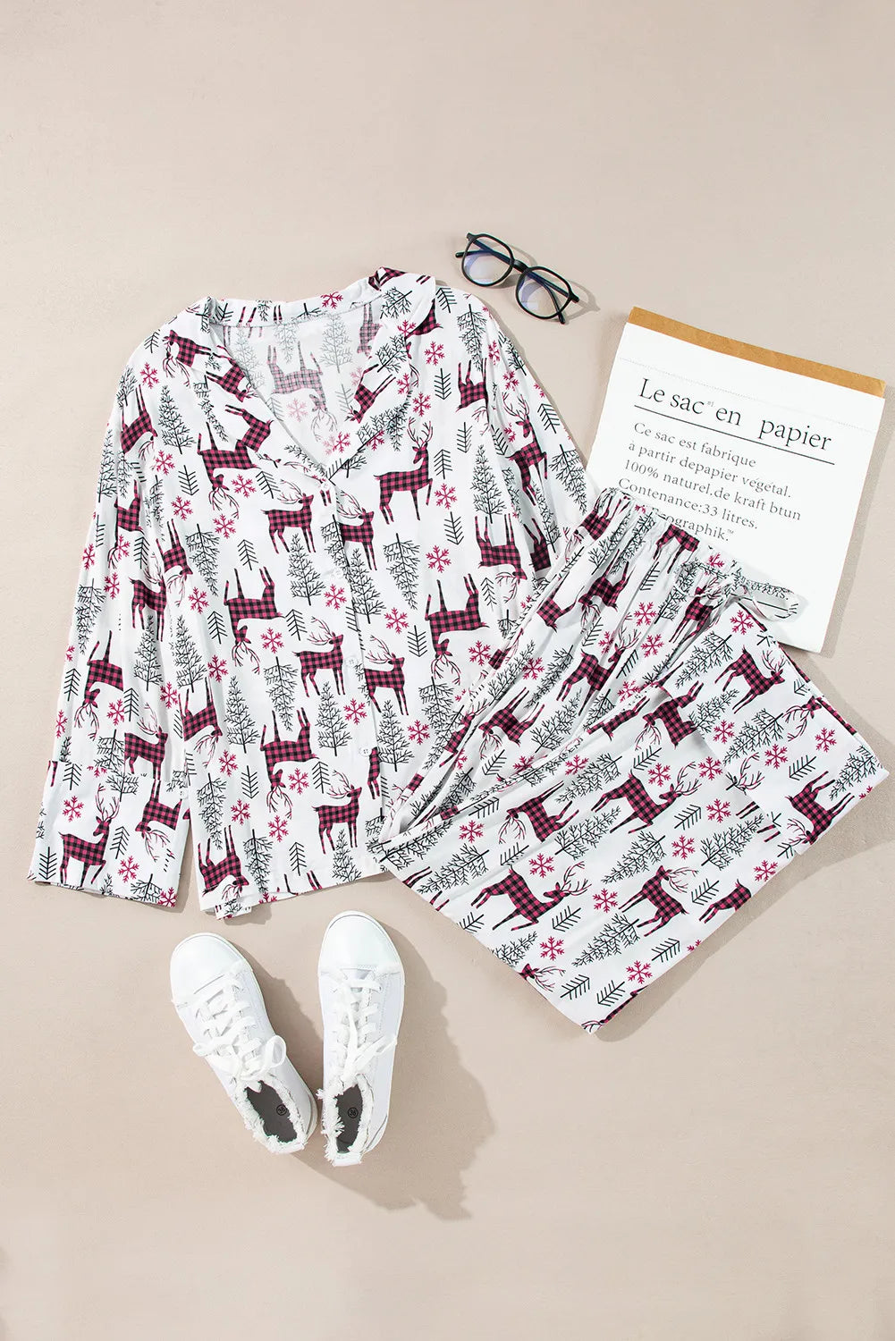 White festive reindeer print pajama set with long sleeves and v-neck top and pants
