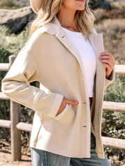 Lined western jacket in eggshell with sherpa trim and button closure.