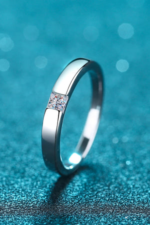 Silver band ring with a square-cut solitaire diamond accent.