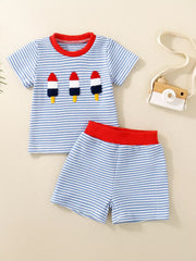 Baby tee and shorts set in Ice Cream blue stripes with rocket embroidery and red trim.