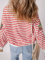 Red and white striped sweatshirt with sequin gift detail on sleeves.