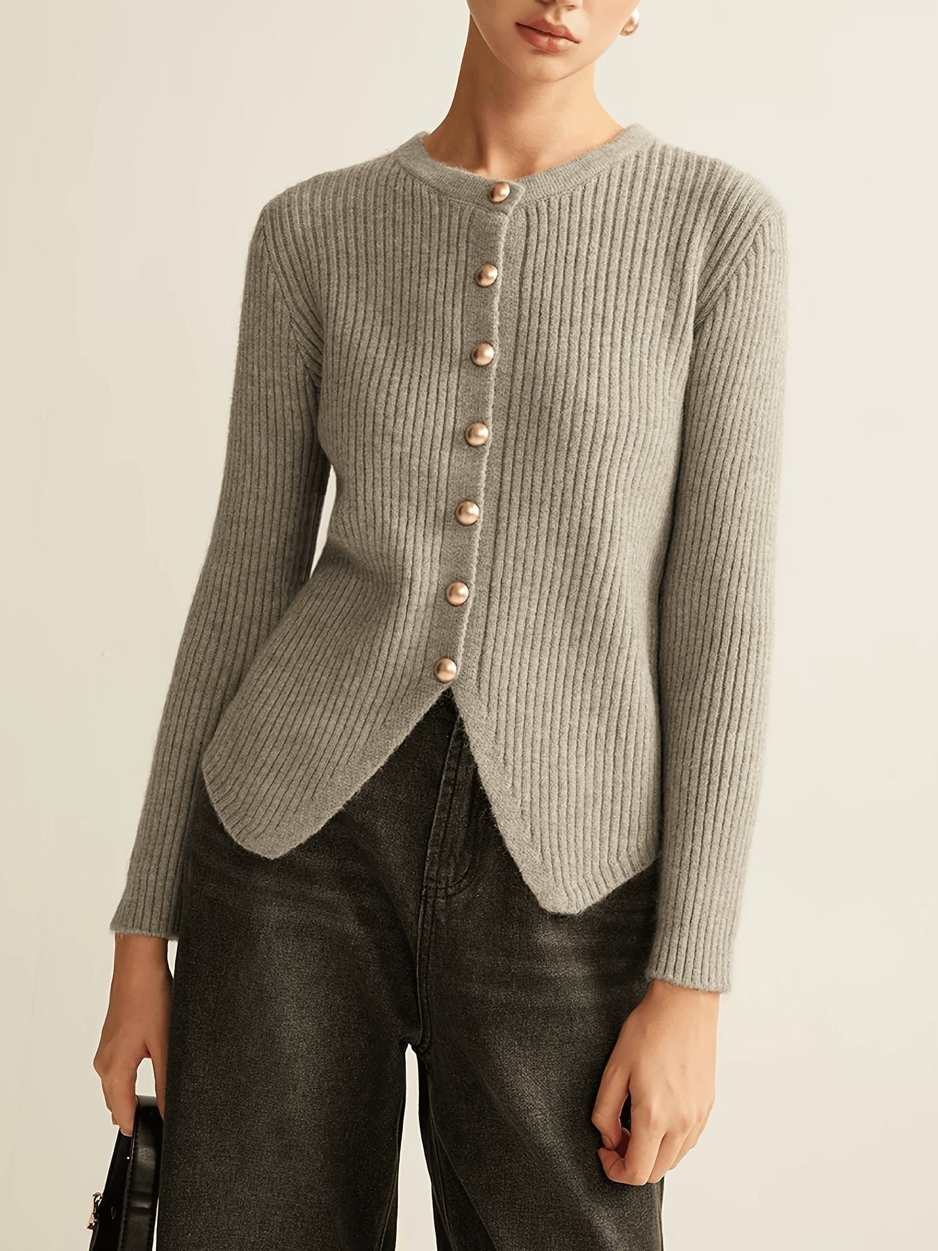 Grey ribbed knit crew neck cardigan with gold buttons and asymmetrical hem