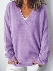 Lavender ribbed knit v-neck sweater with relaxed fit and long sleeves.