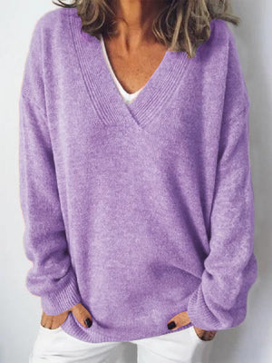 Lavender ribbed knit v-neck sweater with relaxed fit and long sleeves.