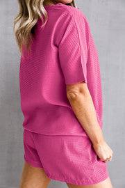 Hot Pink waffle knit co-ord set with short sleeves and shorts.