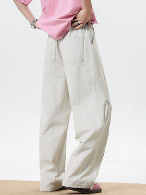 Men's cream wide leg sweatpants with elastic waist and pockets.