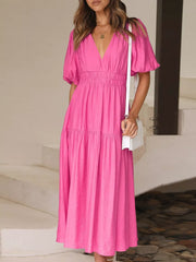 Hot Pink Airy Puff Sleeve Midi Dress with V-neck and tiered skirt.