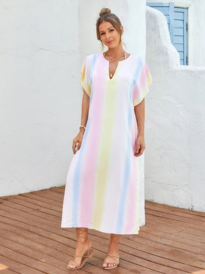 Multicolor striped kaftan dress with V-neck and side slit detail, worn as a cover-up.