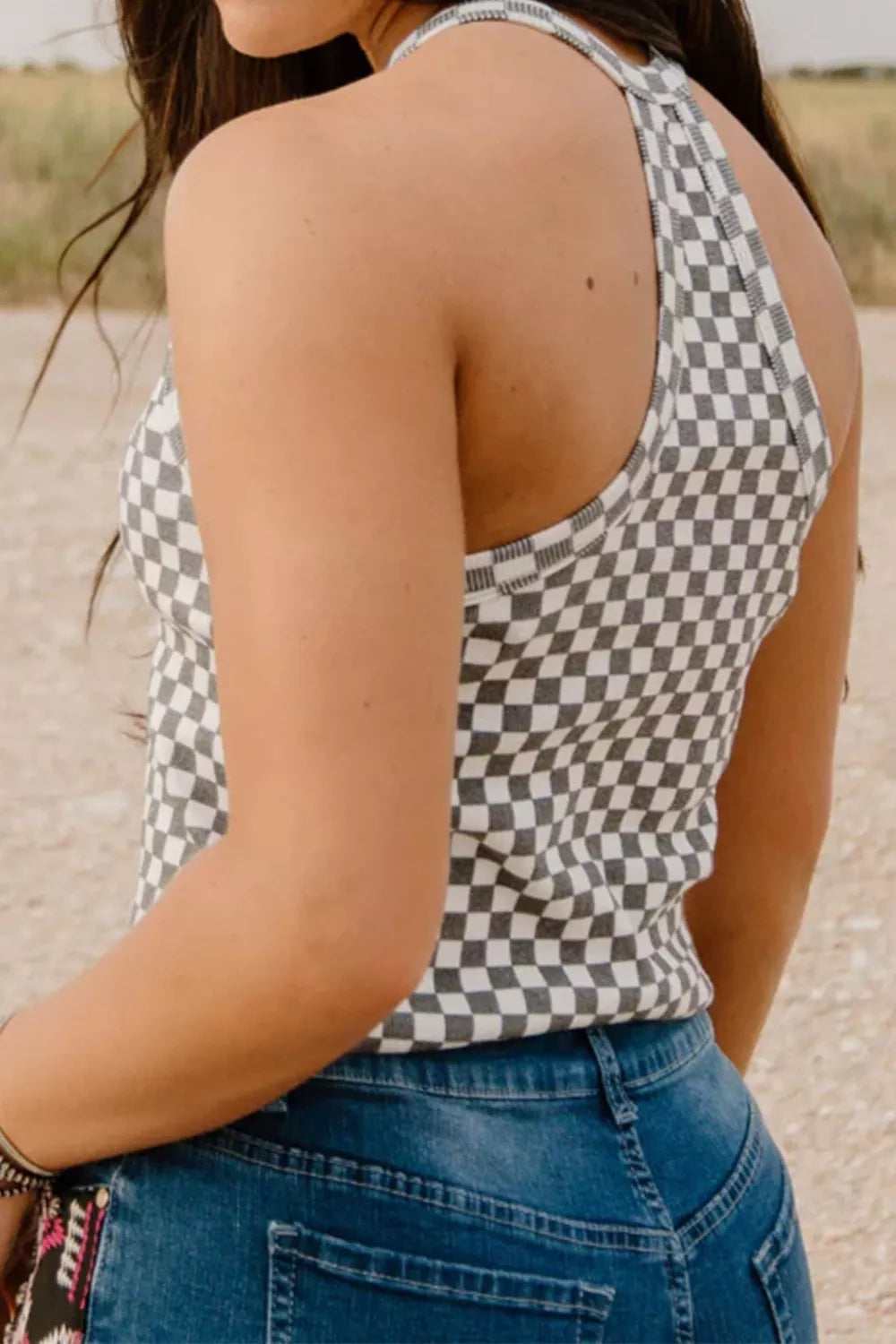 Textured checkered halter tank top in black and white, showing back detail.