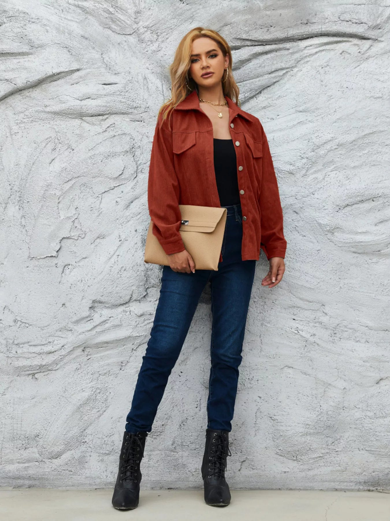 Textured corduroy button-up jacket in amber with two chest pockets and a collared neckline.