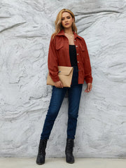 Textured corduroy button-up jacket in amber with two chest pockets and a collared neckline.