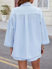 Light blue pleated shorts and oversized button-down shirt set with back pleats