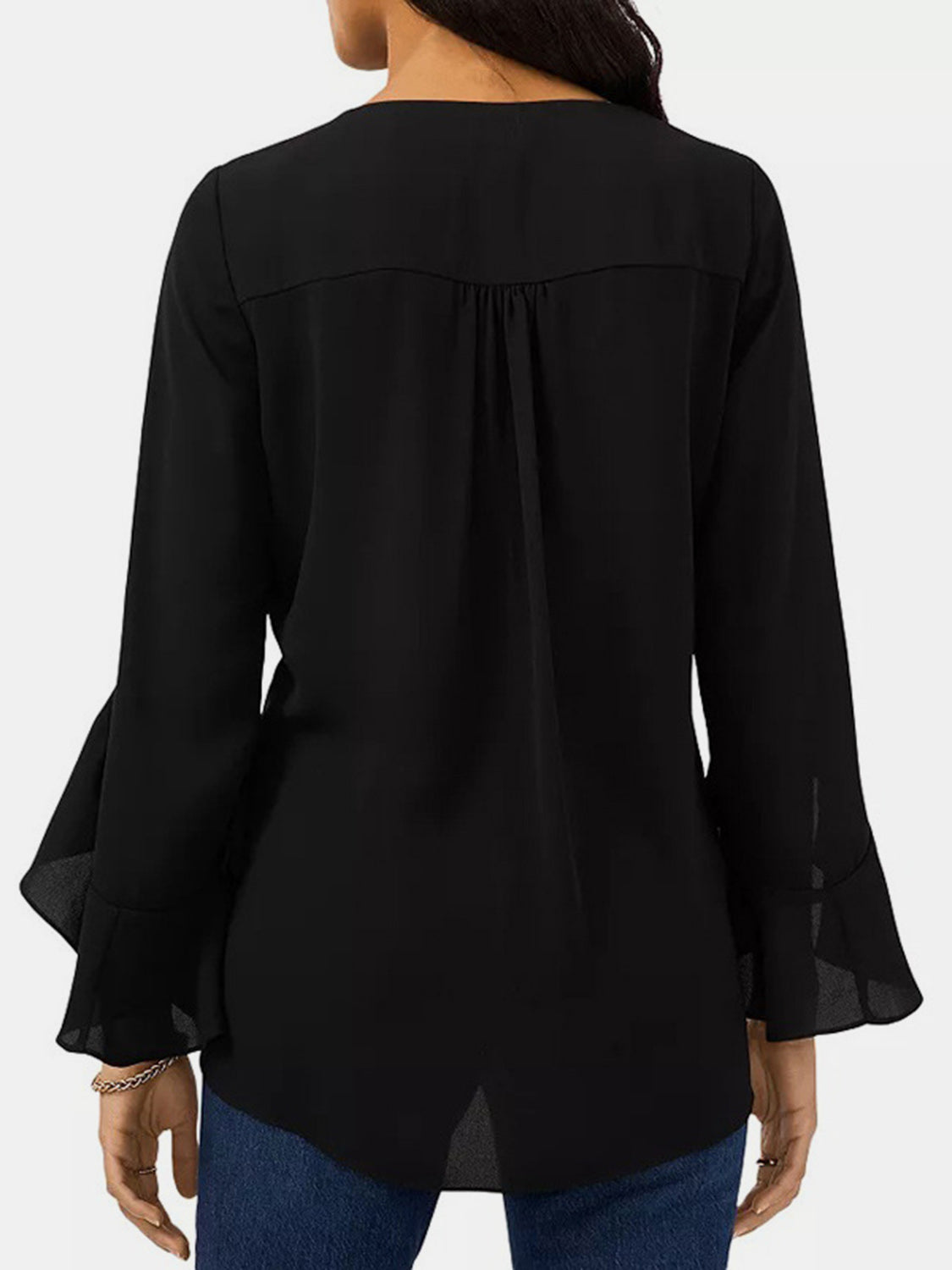 Black chiffon V-neck blouse with flared sleeves and back yoke detail.