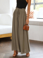 Textured drawstring palazzo trousers in Olive Brown with a ruffled paperbag waist and wide legs.