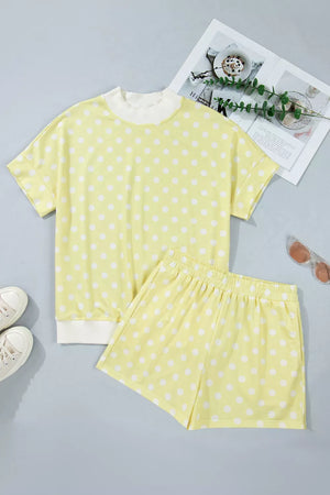 Pastel yellow polka dot top and shorts set with white trim, polyester.